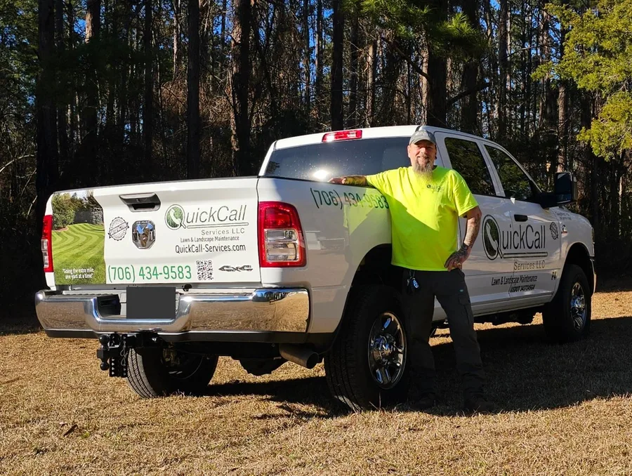 Jason Marriner, founder of Easy P4P and owner of QuickCall Services LLC, standing next to a QuickCall company truck